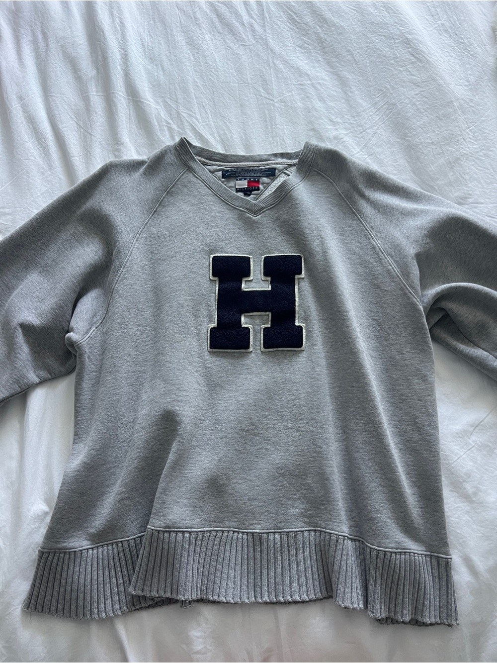 Grey Tommy Hilfiger sweater with varsity letter H